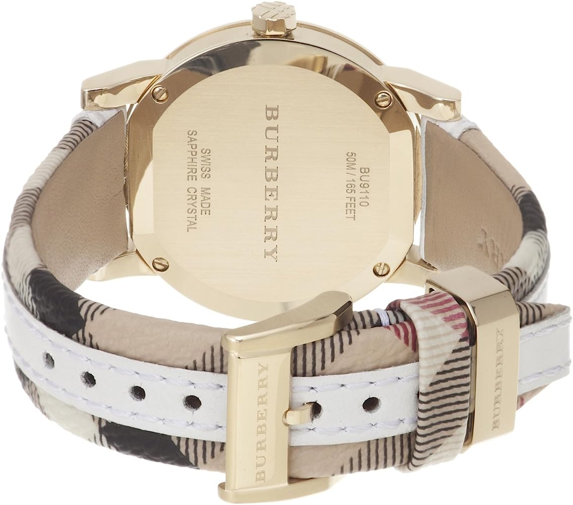 Burberry The City watch caseback showing engraved text and white check leather band detail