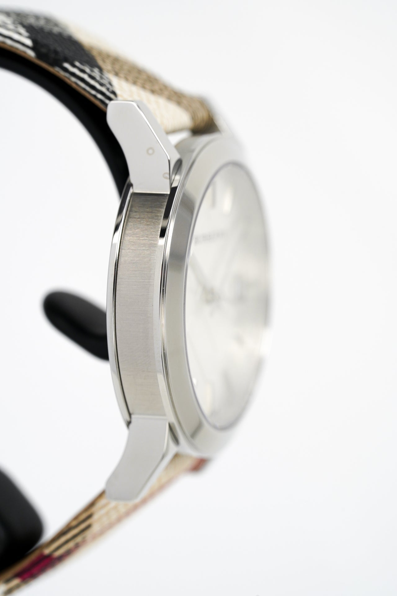 Side view of Burberry The City watch showing steel case profile and Nova Check fabric strap