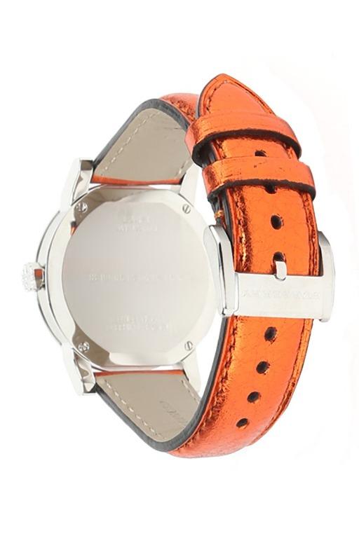 Burberry The City caseback showing polished stainless steel case and orange leather strap