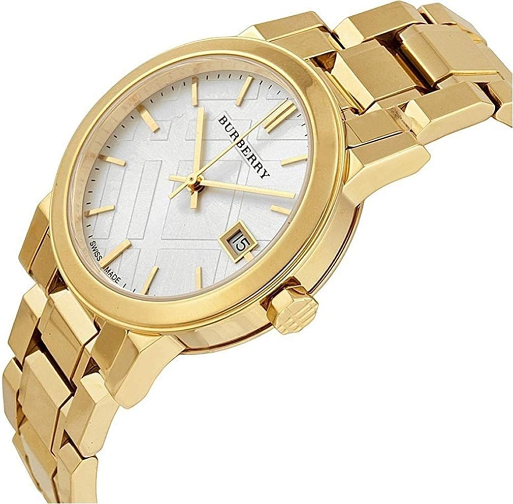 Burberry The City watch at angle showing white dial, date window, and gold bracelet