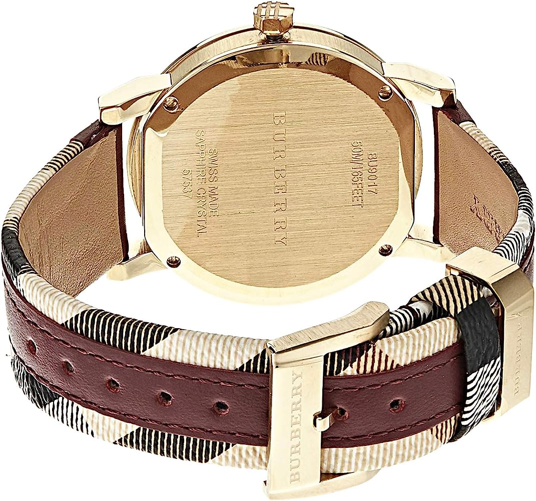 Burberry watch caseback showing gold-tone case and maroon leather strap with check pattern
