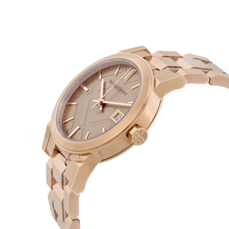 Side angle view of Burberry The City rose gold watch with integrated bracelet and date window