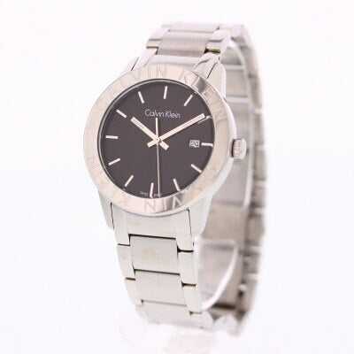 Calvin Klein City watch on wrist displaying black dial and silver steel bracelet