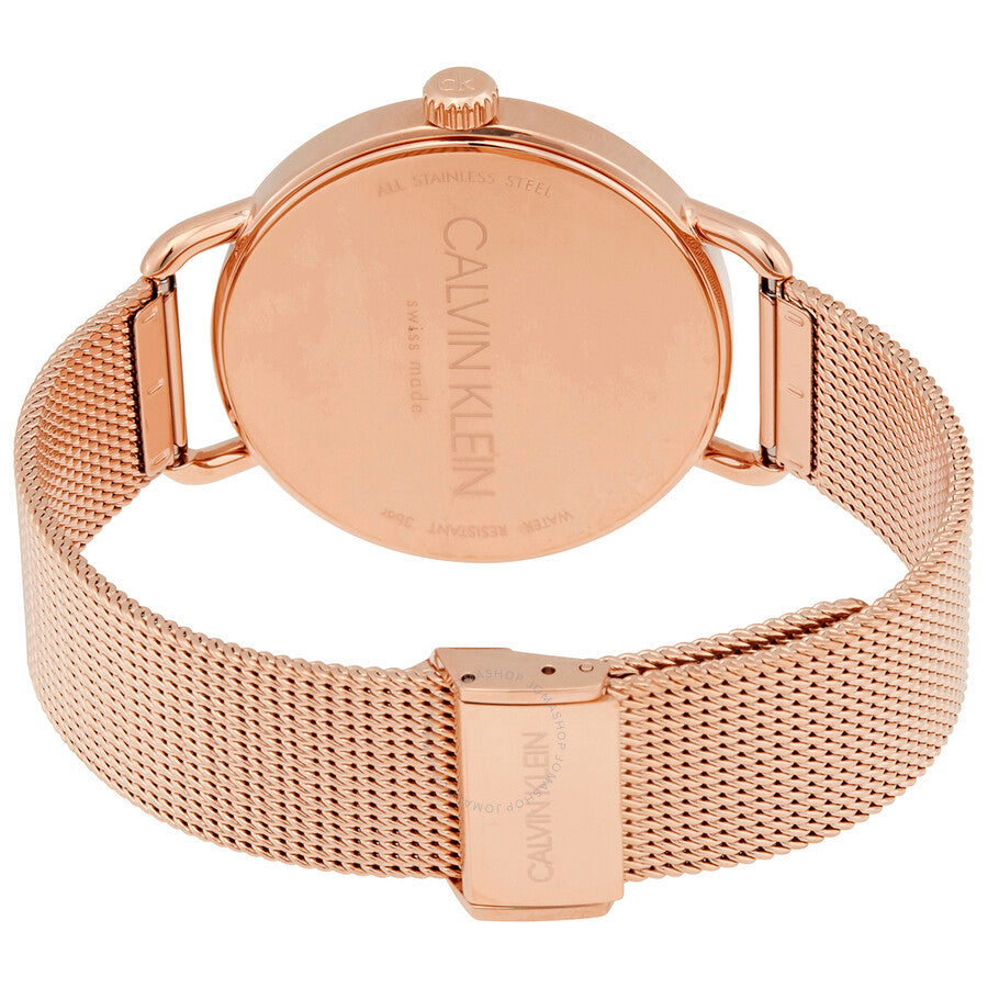 Caseback of Calvin Klein Even watch with Calvin Klein branding and rose gold mesh strap
