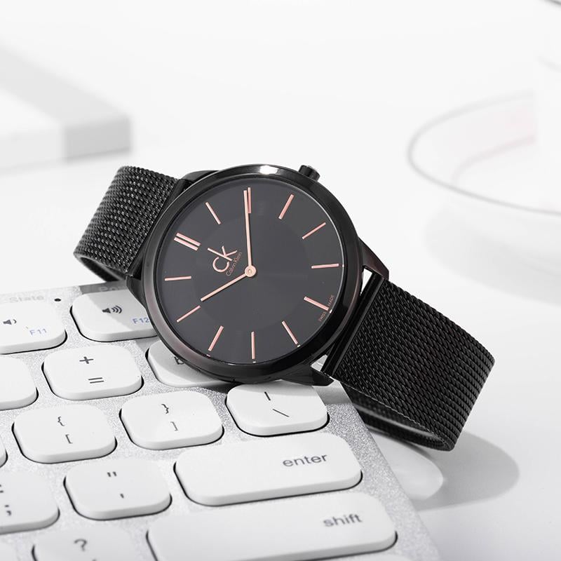 Calvin Klein K3M23421 ladies watch styled on desk with keyboard lifestyle shot