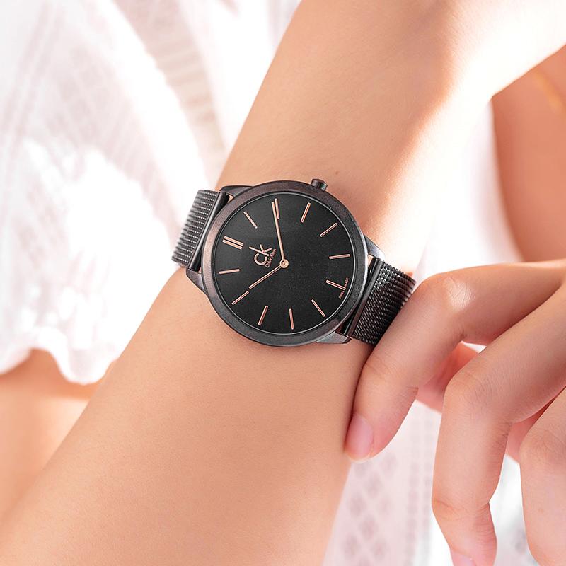 Calvin Klein K3M23421 watch worn on wrist showing black dial and mesh strap