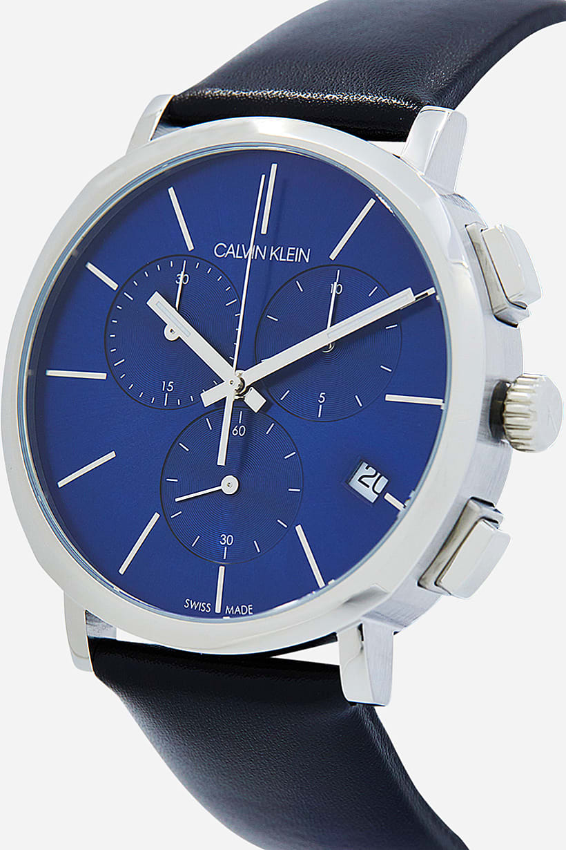Side view of Calvin Klein chronograph watch showing crown and black leather strap