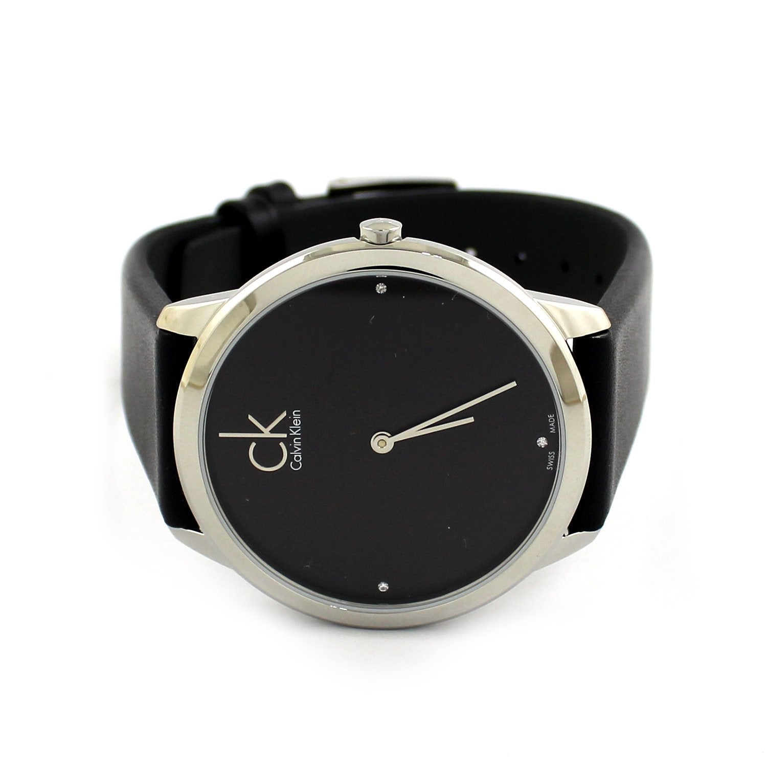 Calvin Klein Minimal K3M221CS women's watch worn on wrist with black leather strap and dial