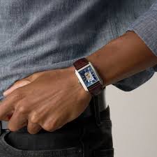 Carraway automatic watch on wrist with brown crocodile leather strap