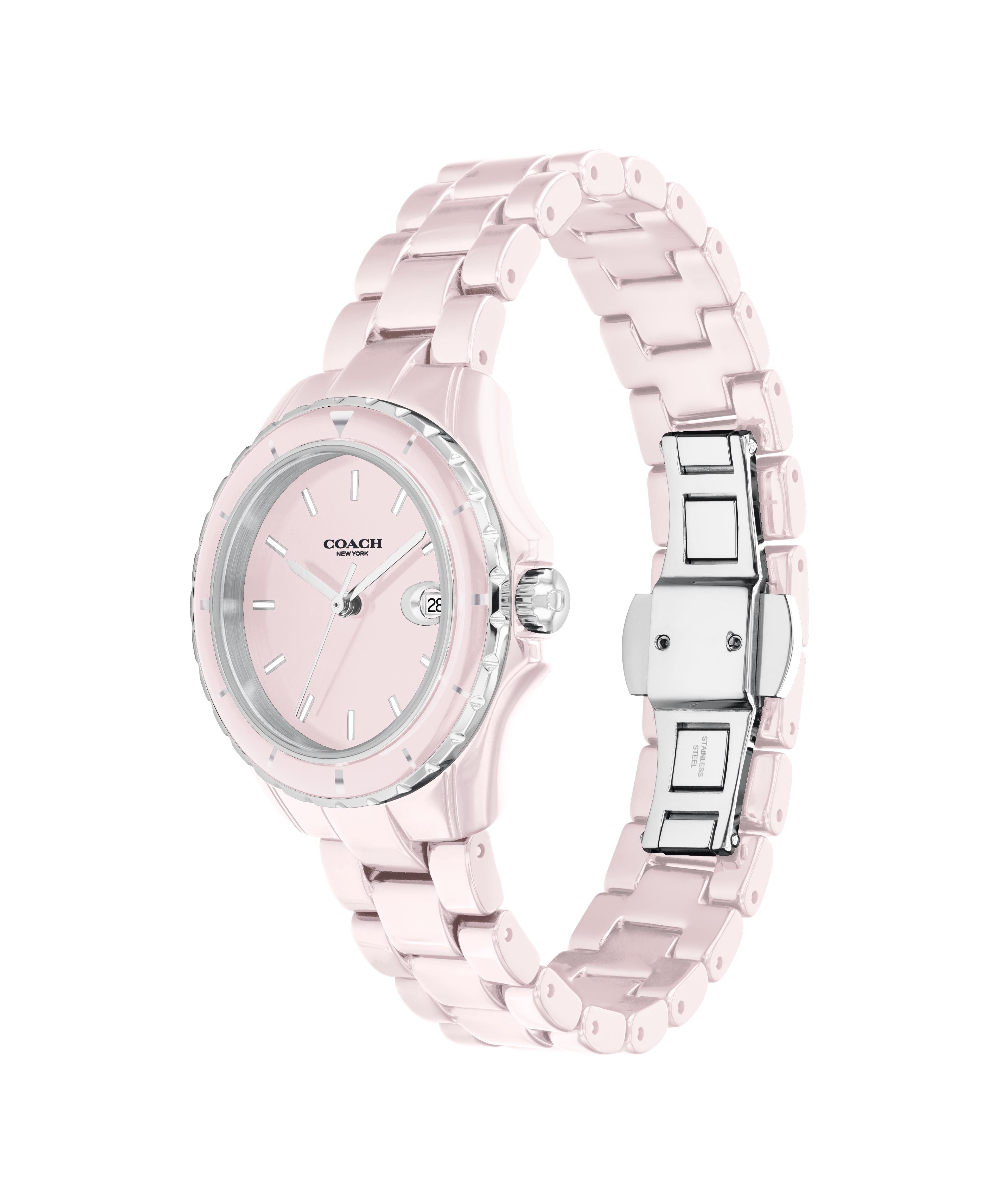 Coach pink stainless steel women's watch shown from side profile view