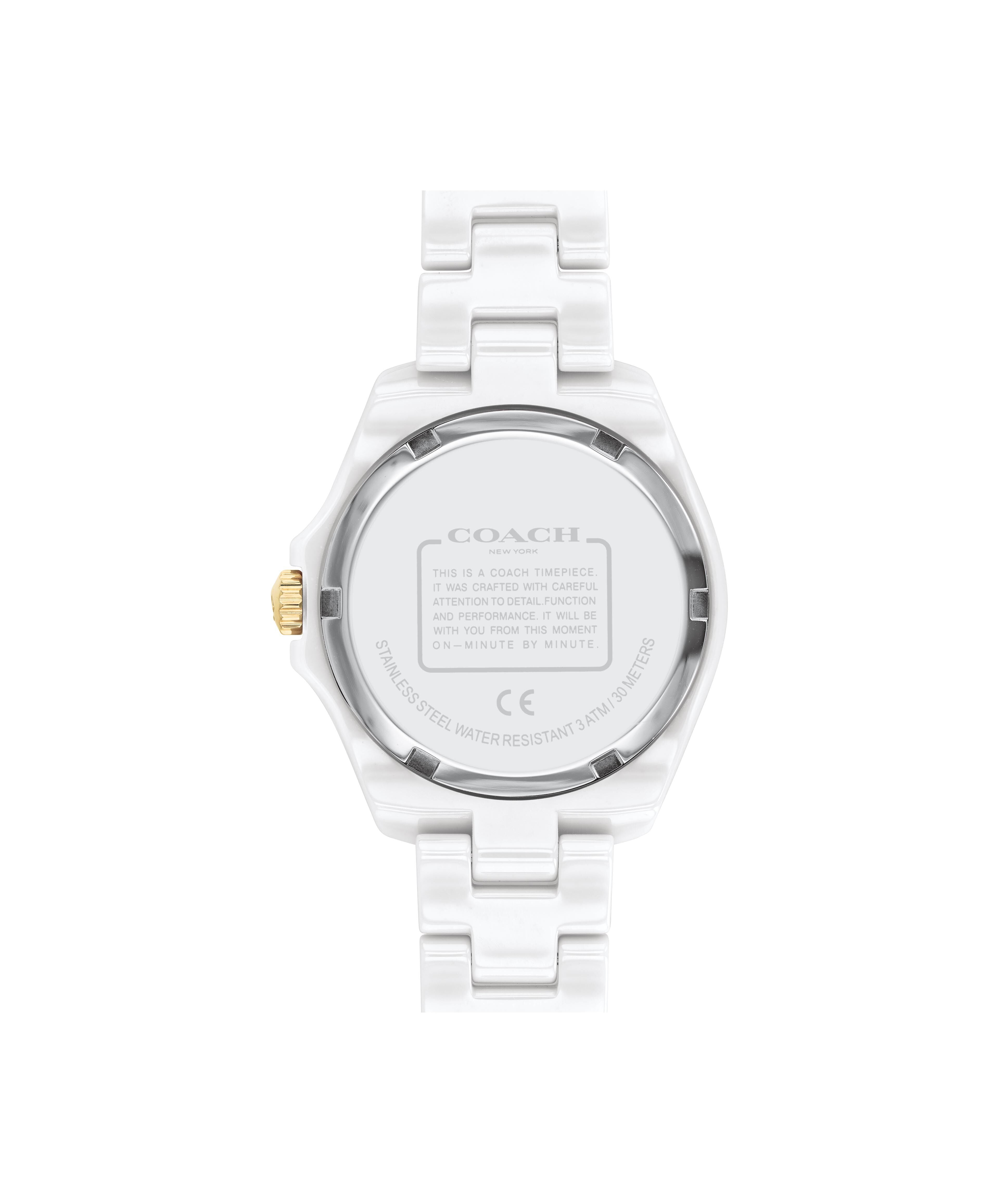 Coach women's watch caseback showing white ceramic back and specifications
