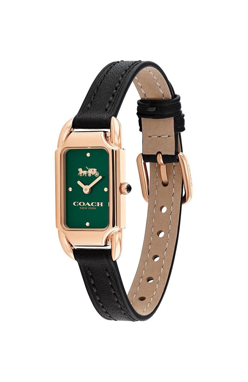 Coach Cadie watch on wrist showing green dial and black leather strap with tan leather lining