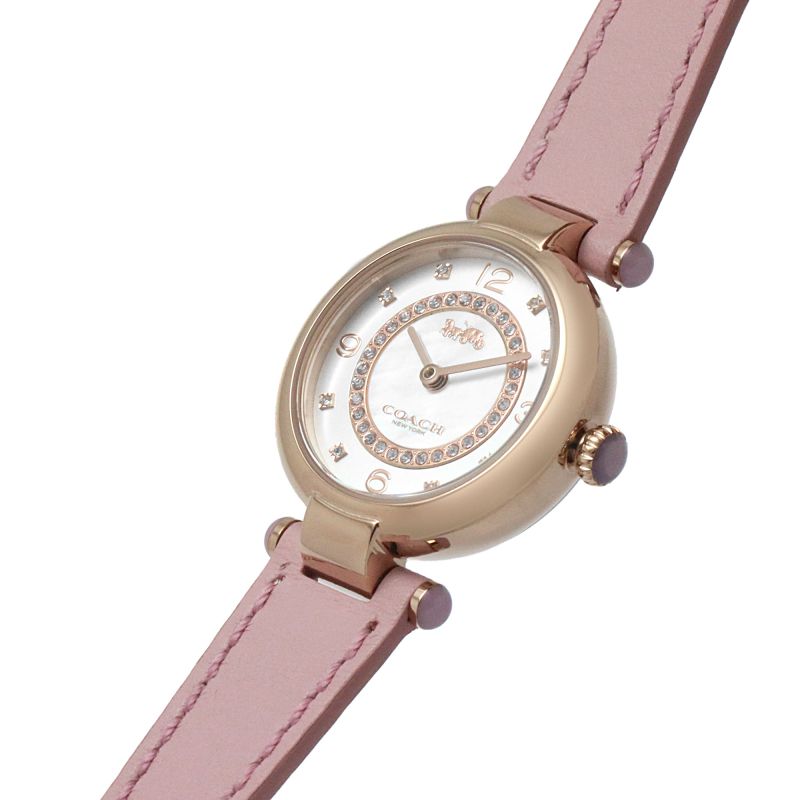Coach Cary watch angled view showing rose gold case, mother-of-pearl dial, and pink leather strap