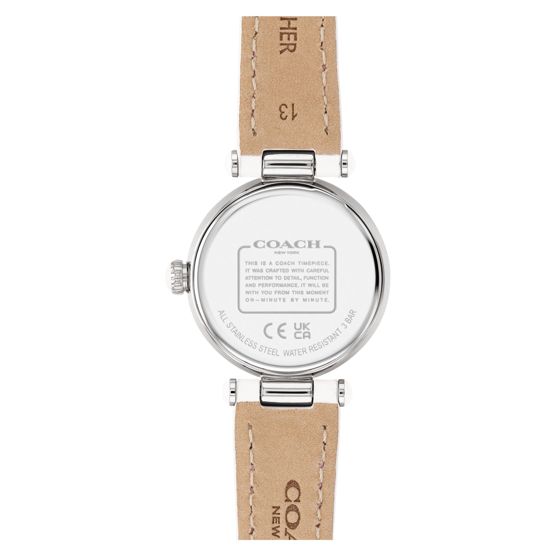 Coach Cary watch caseback showing engraved Coach branding and specifications on tan leather strap