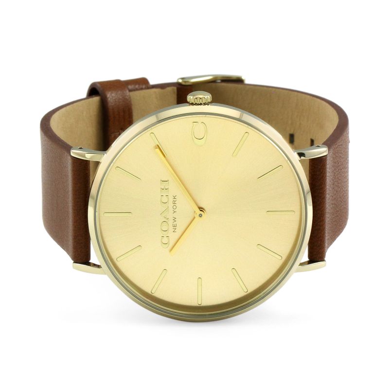 Coach Charles gold watch worn on wrist with leather strap