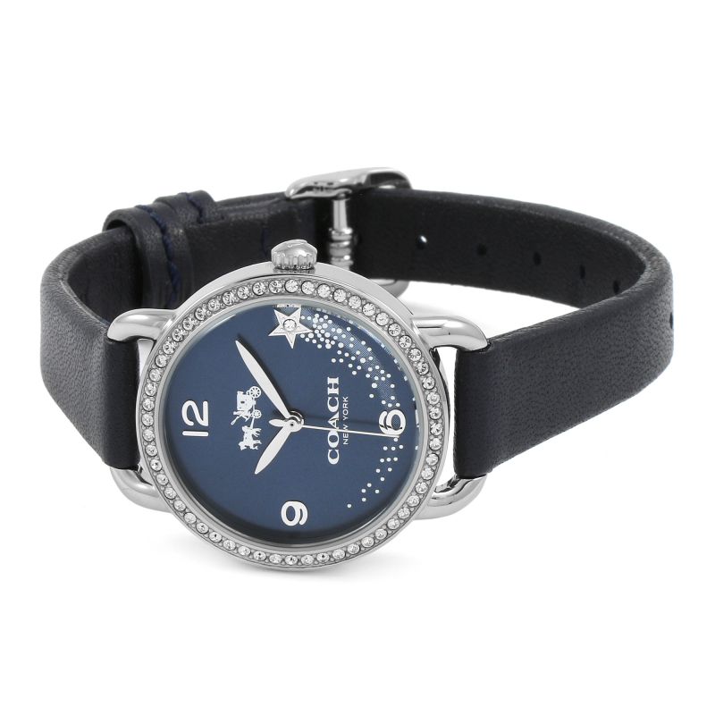 Coach Delancey watch on wrist showing navy dial and black leather strap with crystal-accented bezel