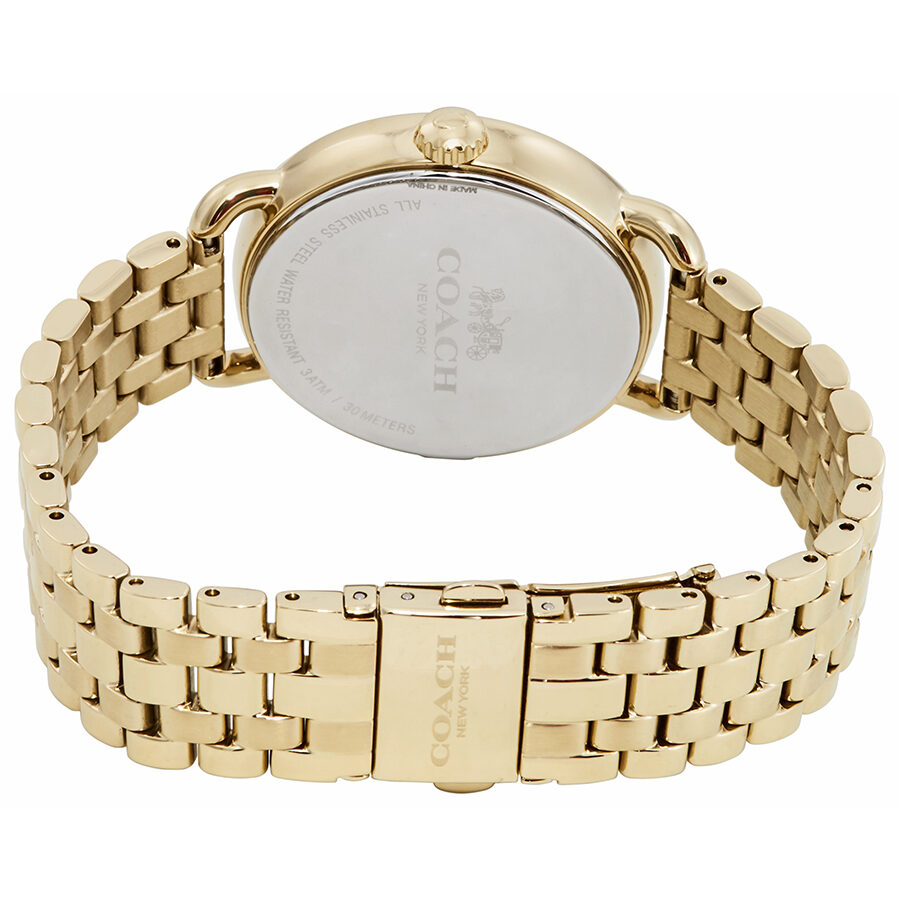 Coach Delancey watch case back showing yellow gold-tone and engraved detail