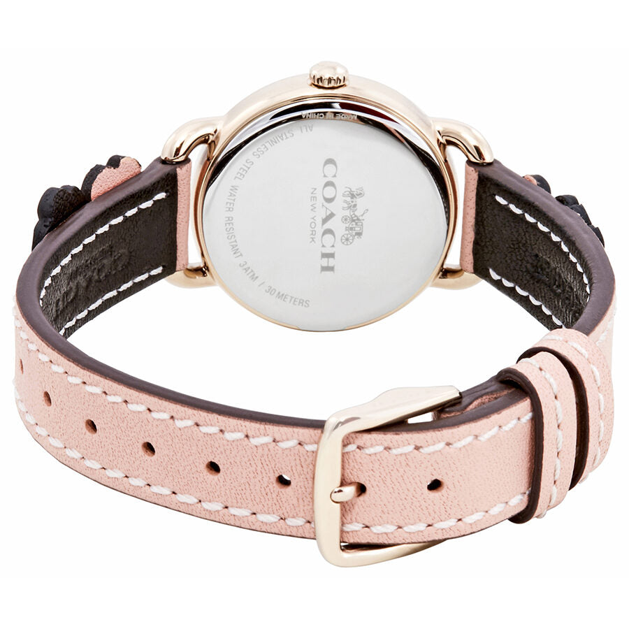 Coach Delancey watch caseback showing engraved text and leather strap with embroidered floral details