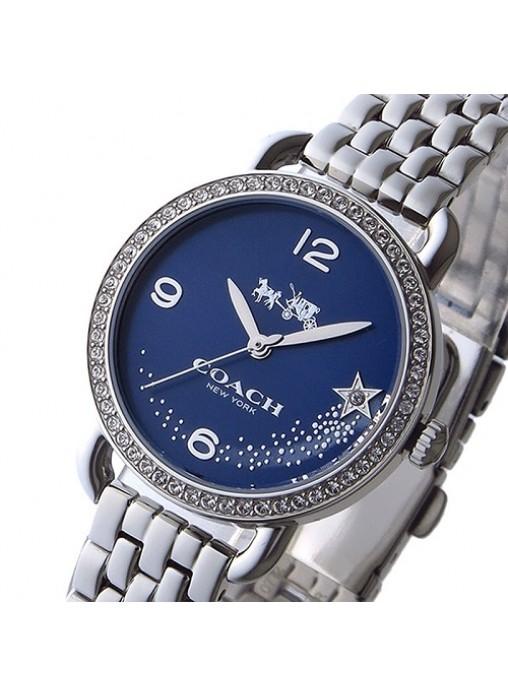 Coach Glitz watch angled view showing blue dial with star motifs and stainless steel band