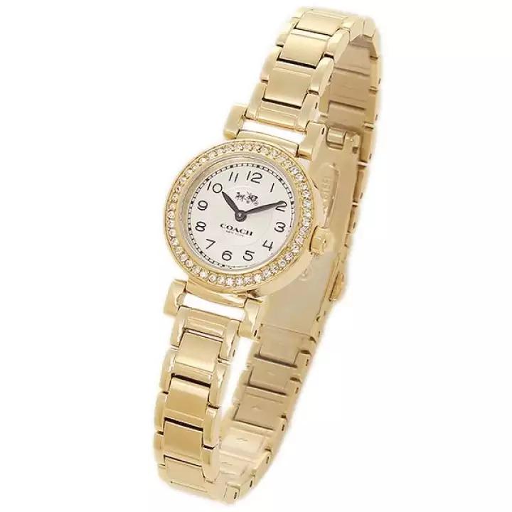 Coach gold tone watch displayed at angle showing bezel and bracelet details