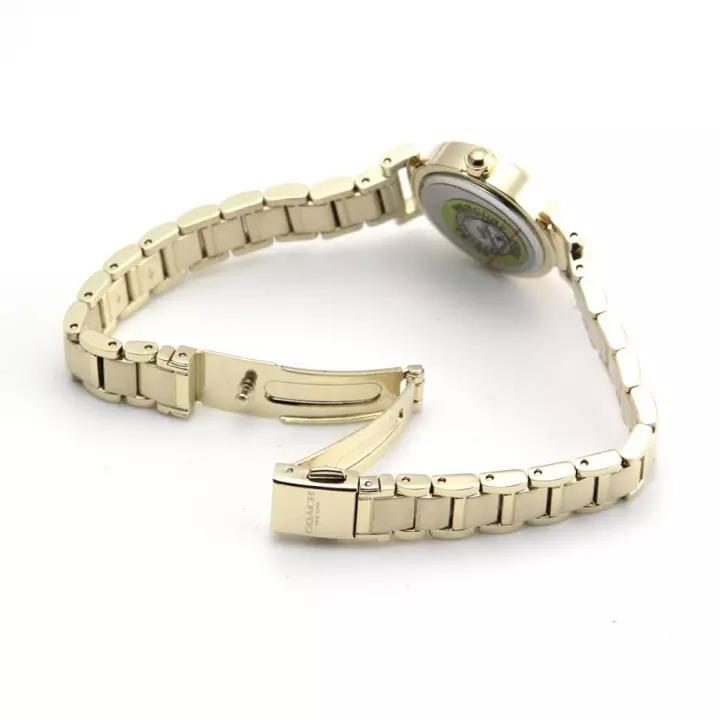 Coach gold tone watch side view showing caseback and bracelet clasp