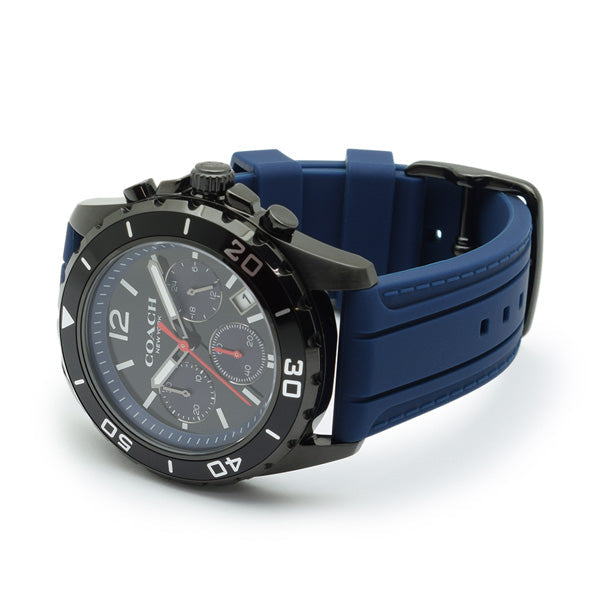 Coach Kent chronograph watch displayed at angle showing black case, blue strap, and dial detail