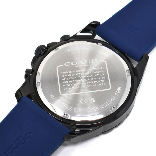 Coach Kent watch caseback showing stainless steel backing with Coach branding and care instructions