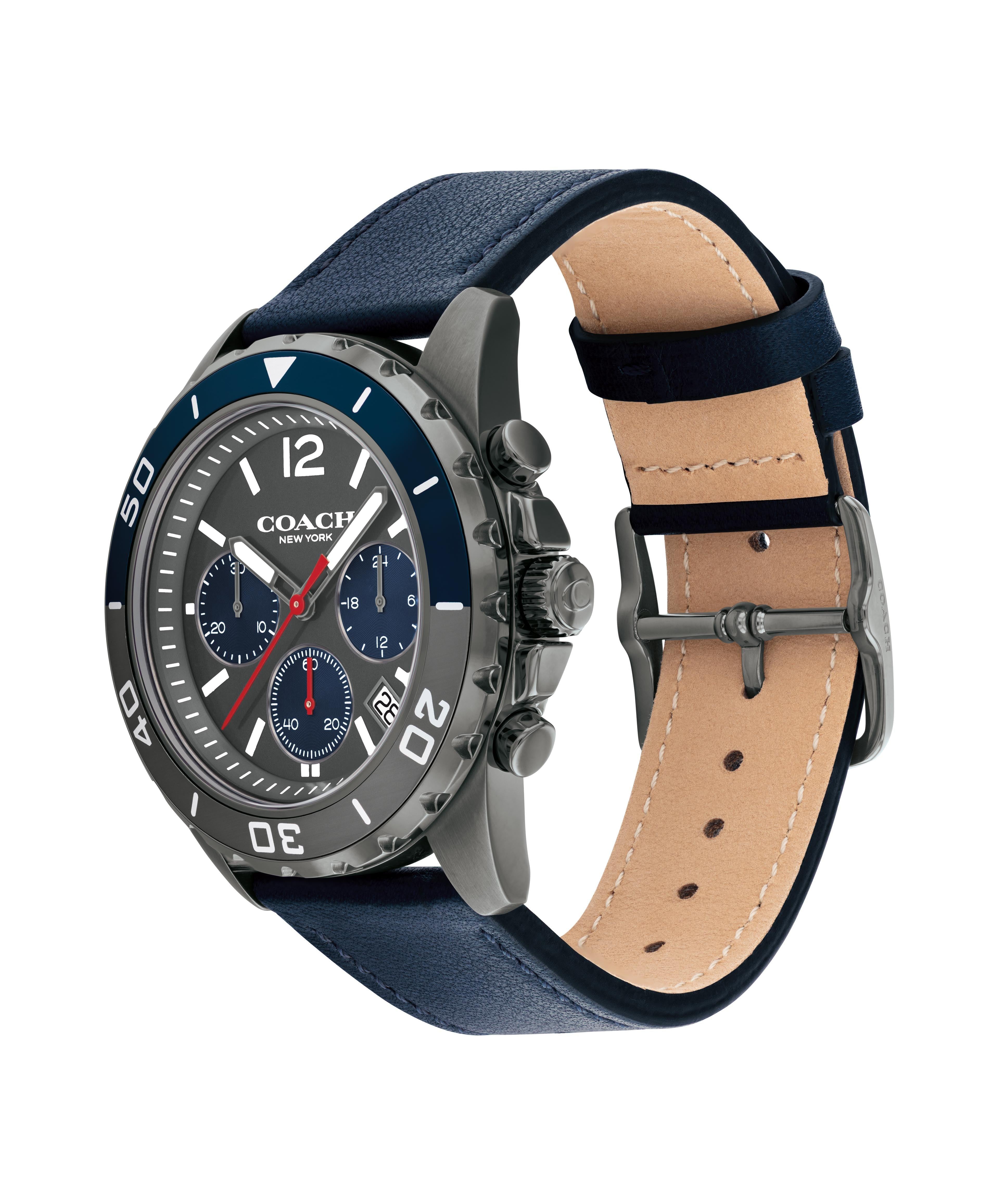 Coach Kent watch side view showing stainless steel case, chronograph pushers, and blue leather strap with tan leather lining