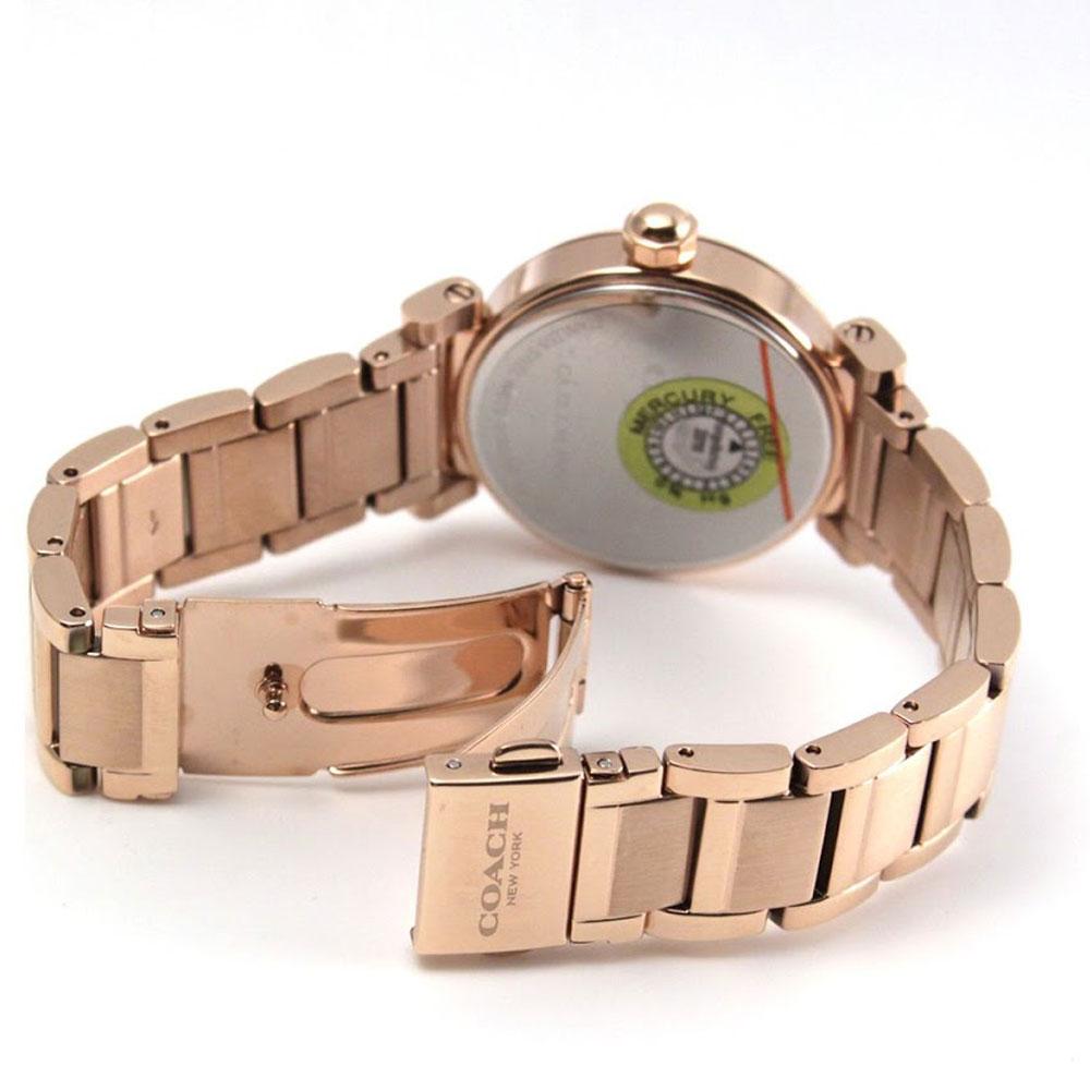 Coach Madison watch caseback showing green authenticity seal and rose gold stainless steel