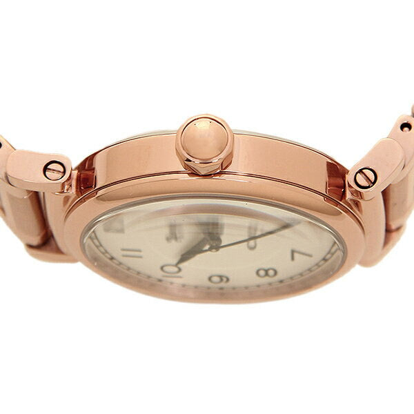 Close-up of Coach Madison watch dial showing Arabic numerals and rose gold crown