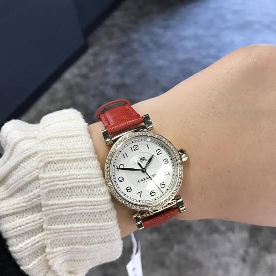 Coach Madison watch on wrist with white dial and crystal bezel paired with red leather strap