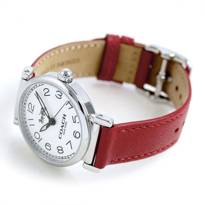 Coach Madison watch on wrist showing red leather strap and silver case with white dial