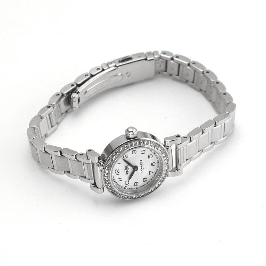 Coach Madison women's watch on wrist displaying white dial and silver metal bracelet