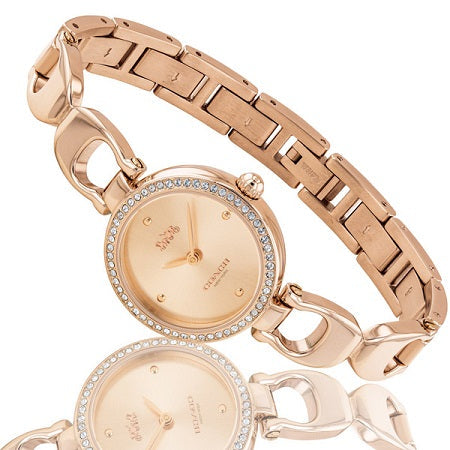 Coach Park ladies watch with rose gold link bracelet and crystal bezel displayed at angle
