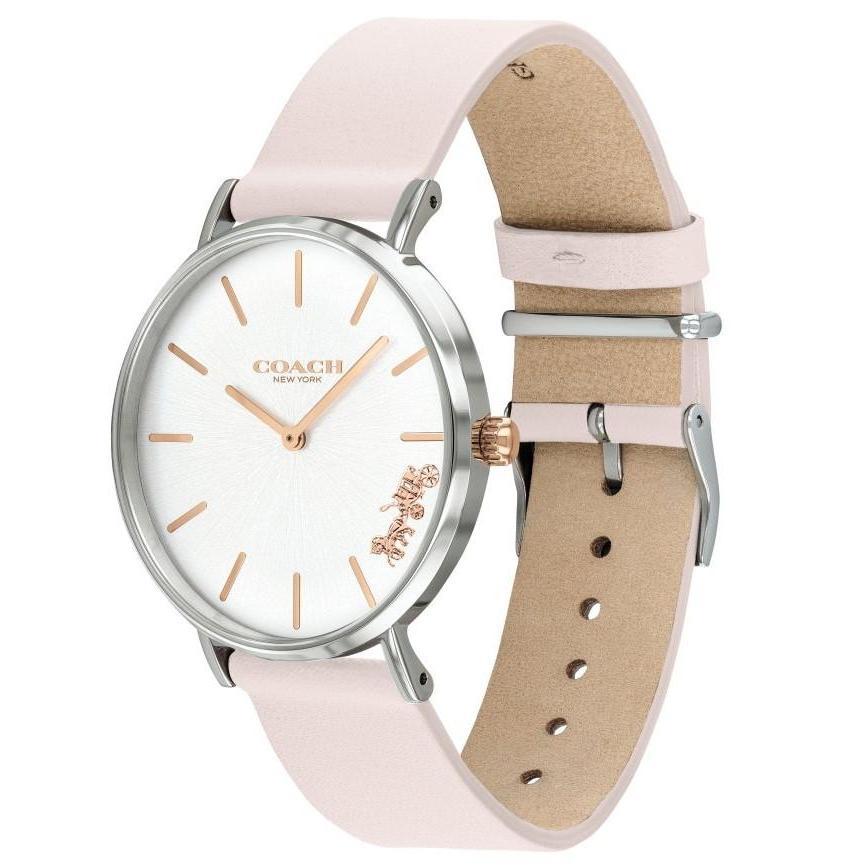Coach Perry watch showing blush pink strap and tan leather interior detail with silver-tone case