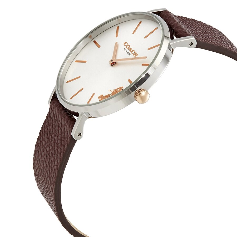 Coach Perry watch at angle showing burgundy leather strap and white dial with rose gold markers