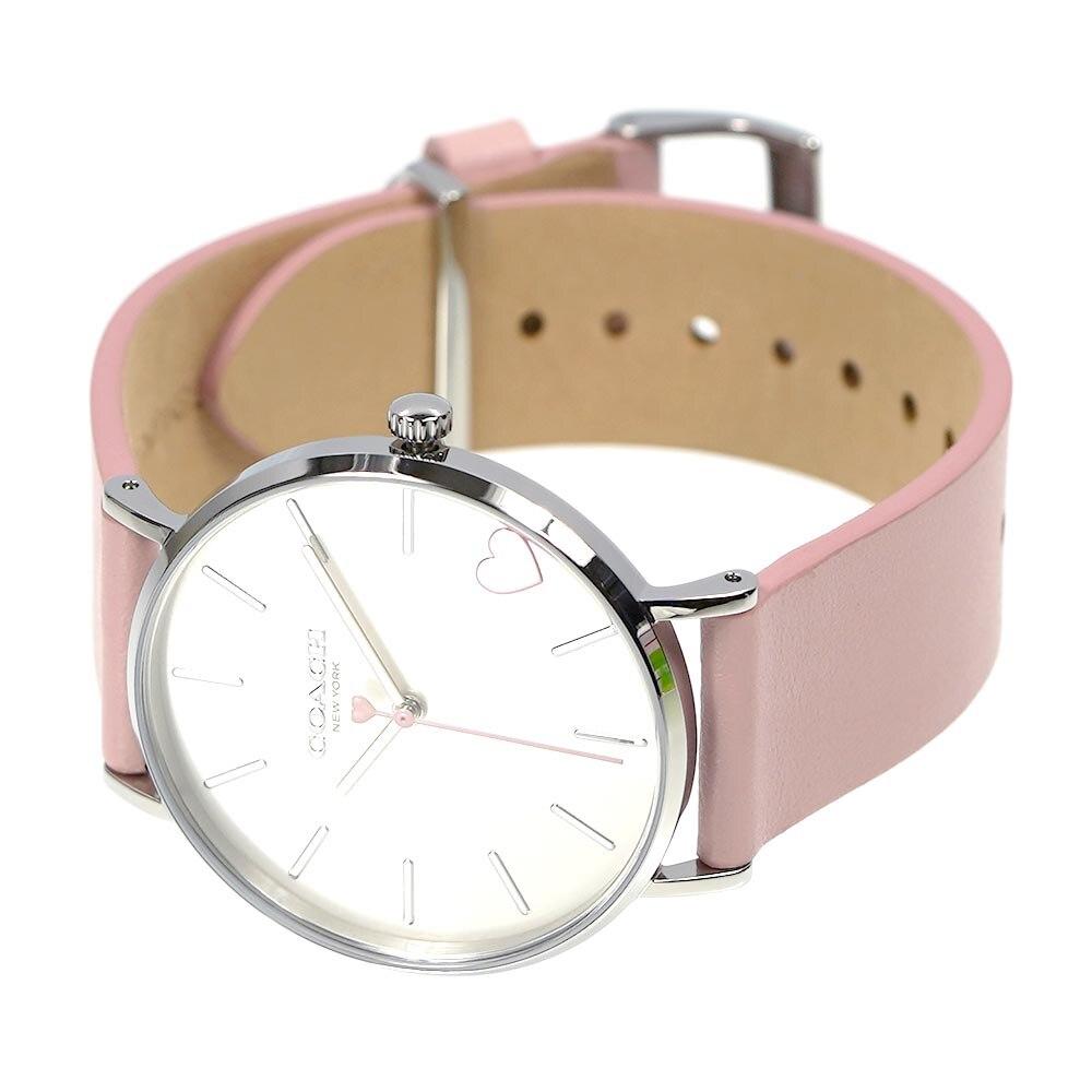 Coach Perry watch displayed from side angle showing blush pink leather strap and dial adjustment holes
