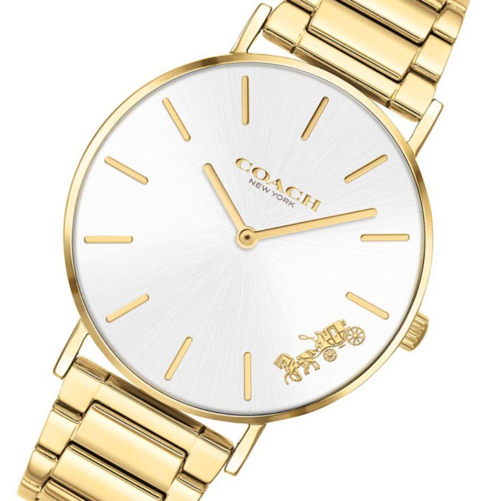 Coach Perry gold watch angled view showing dial, bracelet, and Coach branding