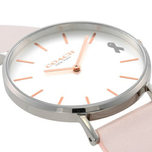 Close-up of Coach Perry white dial with rose gold hour markers and hands