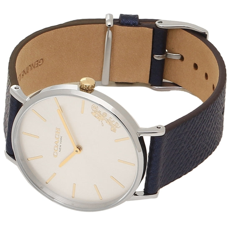 Coach ladies watch worn on wrist with navy leather strap and beige suede interior