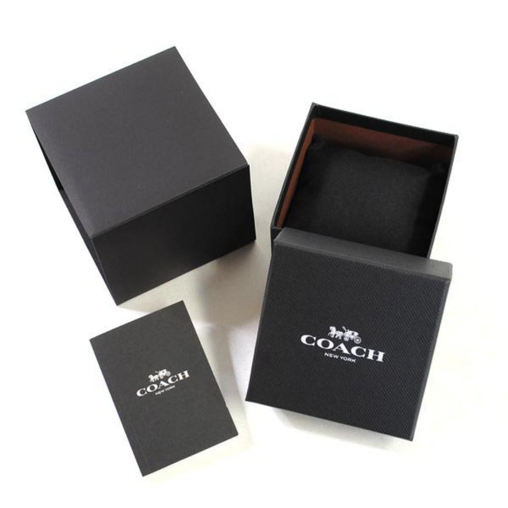 Coach watch packaging with branded black box, inner box, and documentation