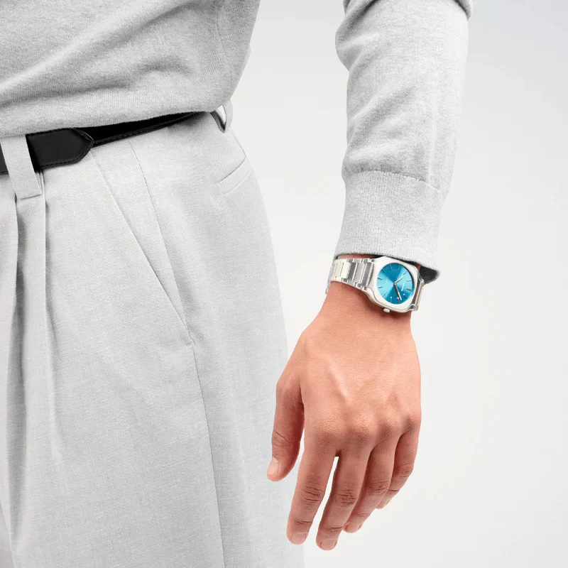 D1 Milano Square Maldives watch worn on wrist, showing sea blue dial and silver strap