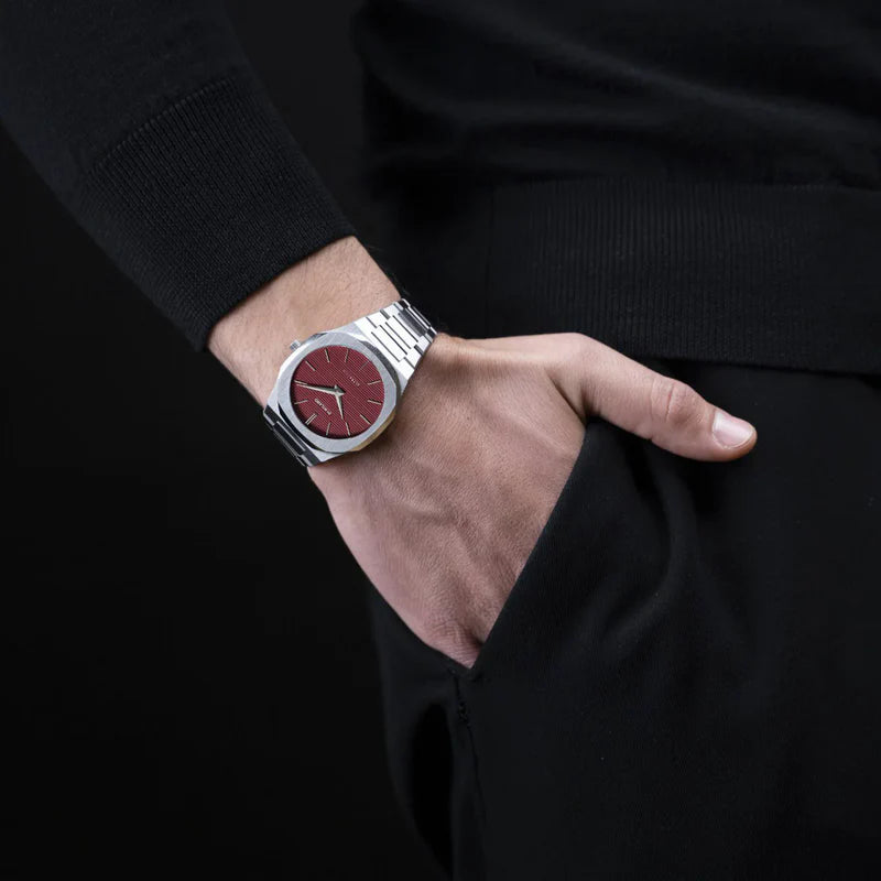 D1 Milano UTBJ11 silver watch with red dial worn on wrist