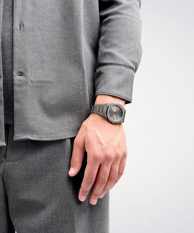 D1 Milano UTBJ22 grey dial men watch worn on wrist with formal attire