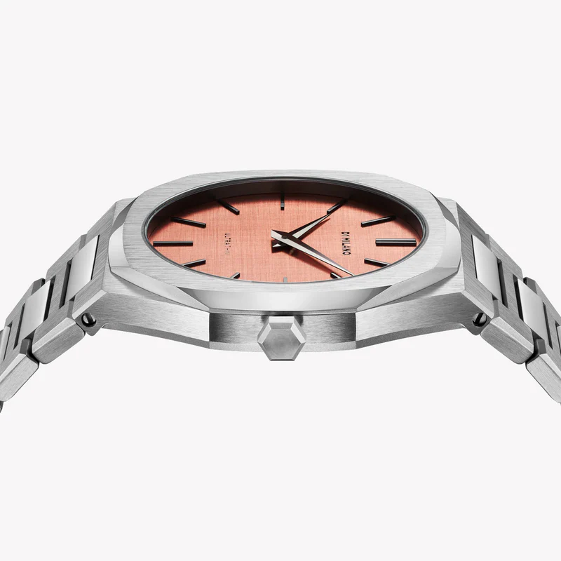 D1 Milano watch dial detail showing rose gold face with minimalist hour markers