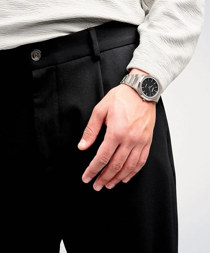 D1 Milano Ultra Thin 40mm automatic watch worn on wrist with silver case and black dial