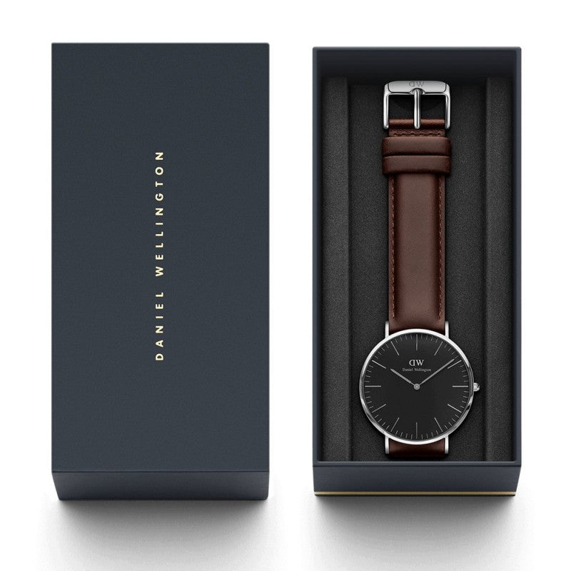 Daniel Wellington Bristol watch with packaging, owner's guide, and brown leather strap