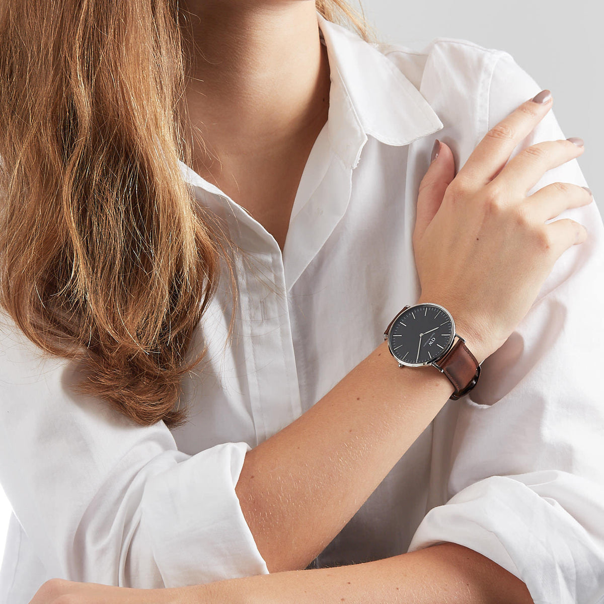 Daniel Wellington Bristol 40mm watch worn on wrist with brown leather strap