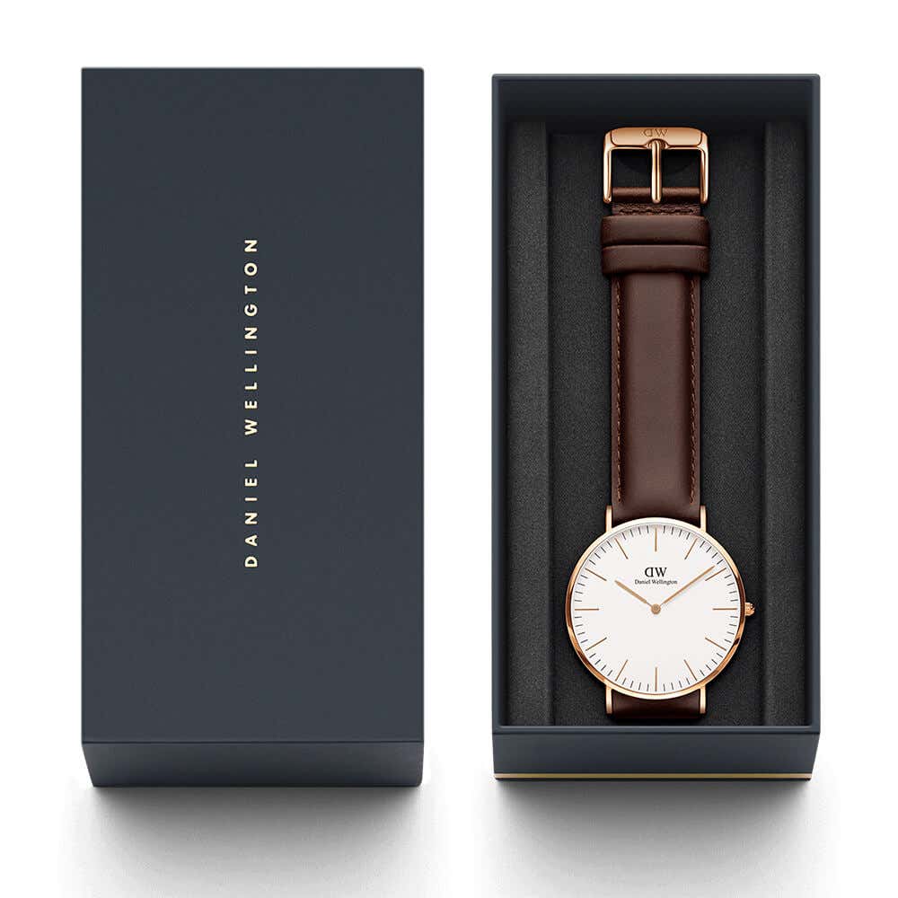 Daniel Wellington Classic Bristol watch with packaging, user manual, and leather strap in presentation box