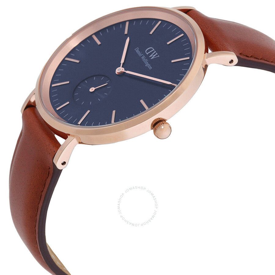 Daniel Wellington Classic Multi-Eye watch angled view showing blue dial, rose gold bezel, and cognac strap